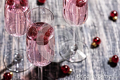 Pink sparkling cocktail with a raspberry. Stock Photo