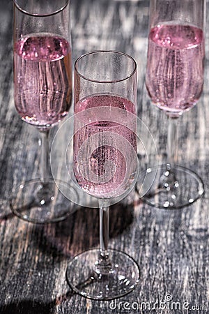 Pink sparkling cocktail with a raspberry. Stock Photo