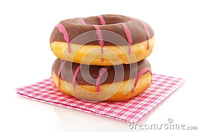 Pink striped donuts with chocolat on napkin Stock Photo