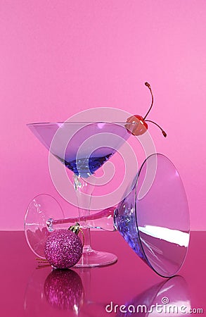 Pink theme Happy New Year party with vintage blue martini cocktail glass and New Years eve decorations Stock Photo