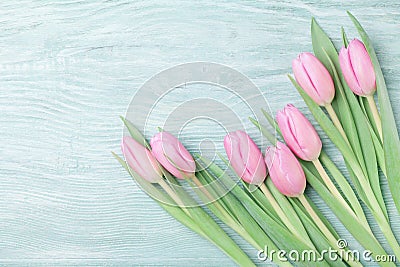 Pink tulip flowers on rustic table for March 8, International Womans or Mothers day. Beautiful spring card. Top view. Stock Photo
