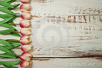 Pink Tulips bouquet with Space for text on a wooden background Stock Photo