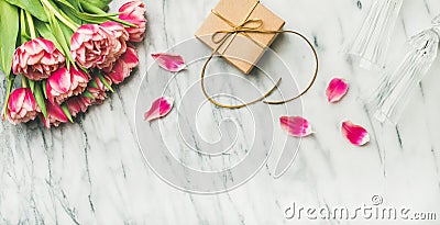 Pink tulips, champaign glasses and gift box with copy space Stock Photo