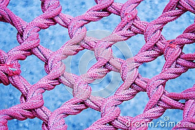 Pink twisted, interlaced rope, fiber texture Stock Photo