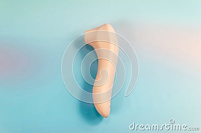 Pink vacuum wave vibrator for clitoris stimulation. Sex toy for women on light blue background Stock Photo