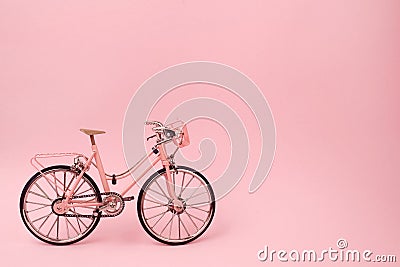 Pink vintage bicycle on pink background. pastel minimal style concept. Stock Photo