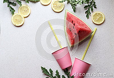 Pink watermelon slice, juice glasses with straws, lemon slices, top view, place for text-the concept of making fresh healthy Stock Photo