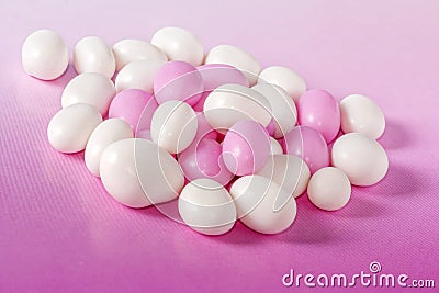 Pink and white candy dragees. Stock Photo