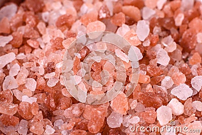 Pink and white large Himalayan salt in a white saucer Stock Photo