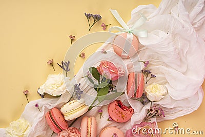 Pink and white macaroons cakes with big and small flower buds ar Stock Photo