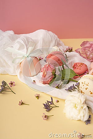 Pink and white macaroons cakes with big and small flower buds ar Stock Photo