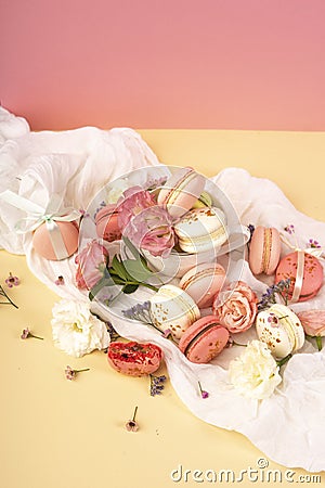 Pink and white macaroons cakes with big and small flower buds ar Stock Photo