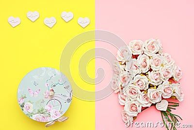 Pink and white roses, heart shape stones and gift wrapped on flat lay paper, happy mothers day Stock Photo