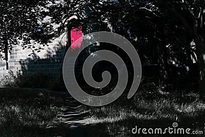 Footpath Leading to a Pink Wooden Door. Stock Photo