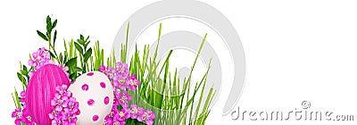 Pink yarrow flowers and Easter painted eggs with green grass Stock Photo