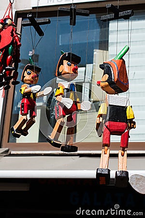 Pinocchio dolls with long nose. Conceptual fairy tale character Editorial Stock Photo