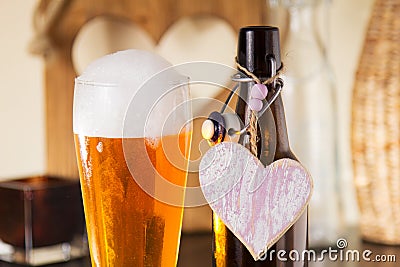 Pint of frothy beer with a heart Stock Photo