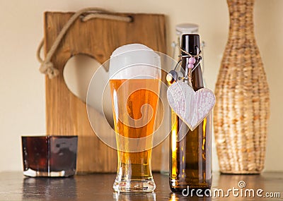 Pint of frothy beer with a heart Stock Photo