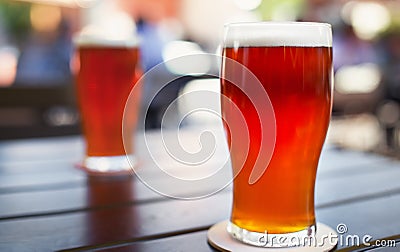 Pint glass of craft beer on table Stock Photo