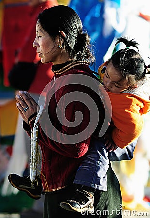 Pious tibet prayer in jokhang temple Editorial Stock Photo