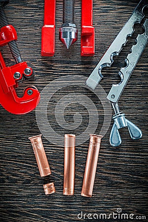 Pipe flaring tool set on wooden board Stock Photo