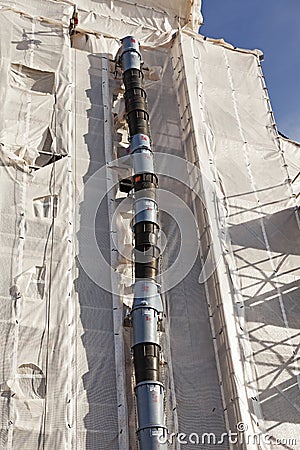 A pipe that sits on the building wall for building debris Editorial Stock Photo