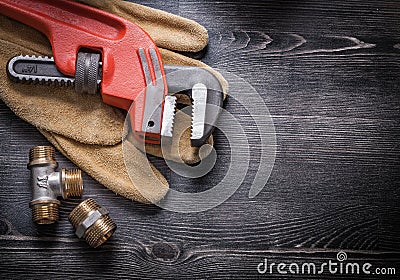 Pipe wrench copper plumbing fixtures leather Stock Photo
