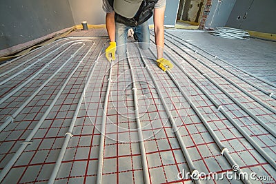 Pipefitter installing system of heating Stock Photo