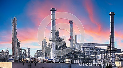 Pipeline and pipe rack of petroleum industrial plant with sunset sky background Stock Photo