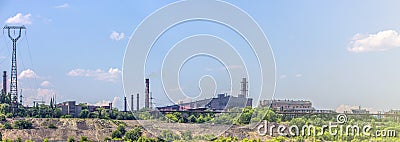 pipeline and power line support, in the photo pipeline and power line tower close-up against the background of blue sky Stock Photo