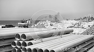 Pipes at a beach construction site along the road between Dubai and Sharjah. Editorial Stock Photo