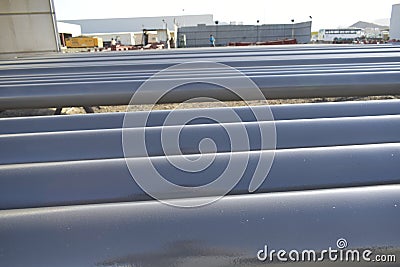 Pipes for fire fighting system and extinguishing water lines in industrial building. painted steel pipes in the paintshop. Muscat Editorial Stock Photo