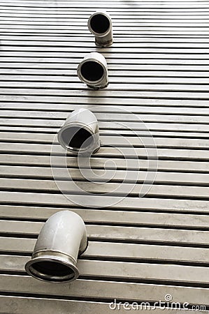 Pipes in a metal floor Stock Photo