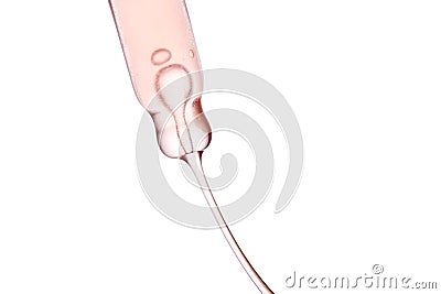 Pipette with a viscous pink cosmetic close-up. Stock Photo