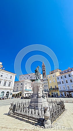 Piran - Statue of renowned violinist Giuseppe Tartini set against picturesque backdrop of Tartini Square Editorial Stock Photo