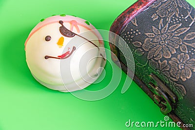Pirate cake and a chest for children on a green background. Stock Photo