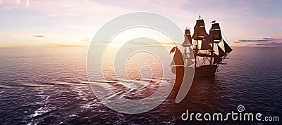 Pirate ship sailing on the ocean at sunset Stock Photo