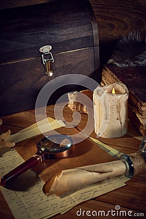 Pirate still life with a treasure chest on wooden table Stock Photo