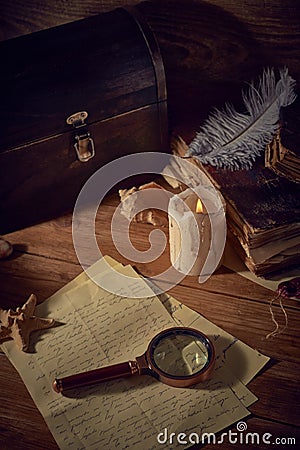 Pirate still life with a treasure chest on wooden table Stock Photo