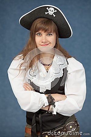 Pirate woman emotionally poses on blue background Stock Photo