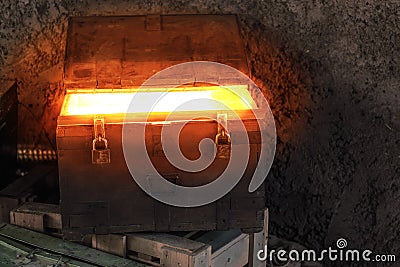 Pirates treasure chest shining a glowing light, mysterious box, fairytale background Stock Photo