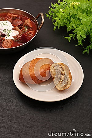 Piroshki, a typical Russian delicatessen bread filled with ingredients Stock Photo