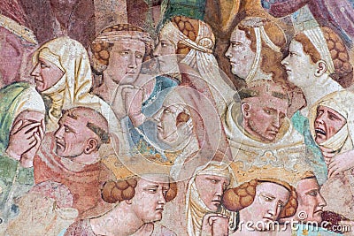 Close-up on women and monks faces painted in ancient medieval fresco Editorial Stock Photo