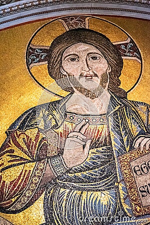 Close-up on golden mosaic showing Jesus making a bless Editorial Stock Photo