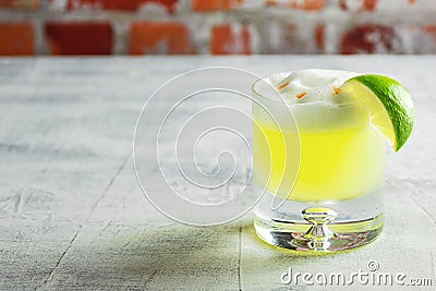 Pisco Sour Cocktail in Glass with Lime Stock Photo