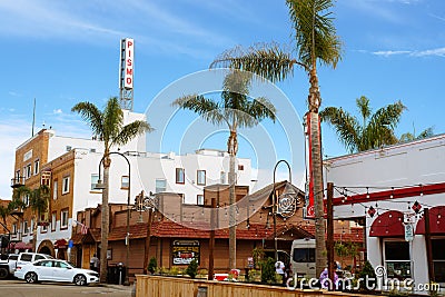 Pismo Beach Pier plaza. Shops, restaurants, walking people, downtown of city, city life Editorial Stock Photo