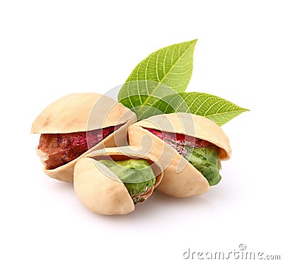 Pistachio nuts with leaves Stock Photo