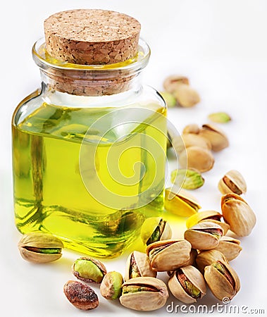 Pistachio oil with nuts Stock Photo