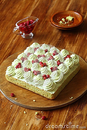 Pistachio Sponge Cake with Wild Strawberry Filling and Pistachio Frosting Stock Photo