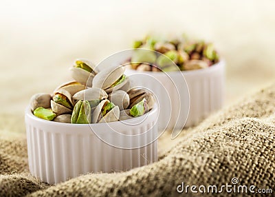 Pistachios in ceramic jars Stock Photo